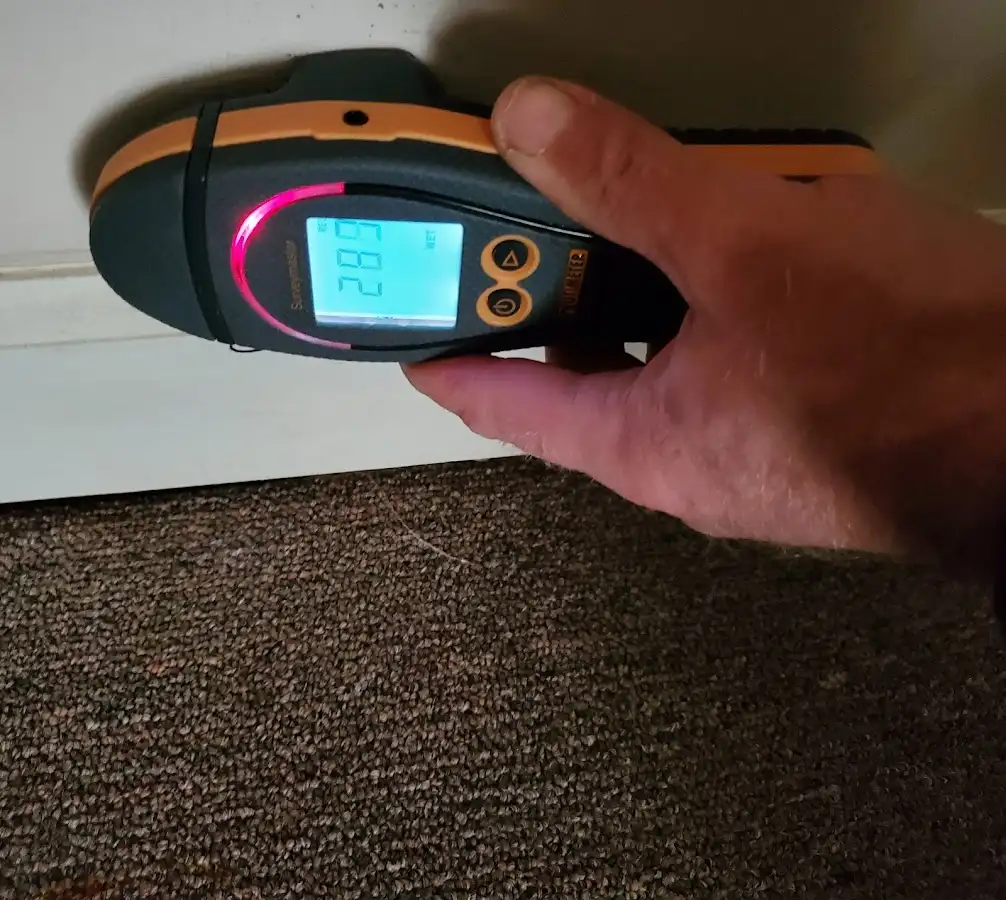Moisture detection at baseboard during Storm Damage Restoration in Upper Sandusky